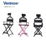 Cross legged makeup chair with headrest.